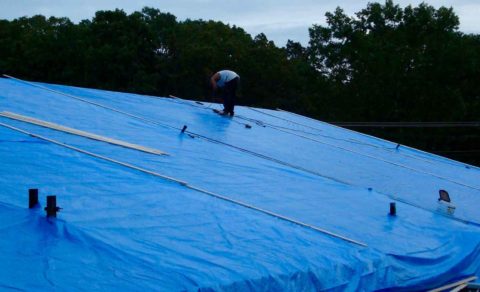 Adding a tarp is step one in emergency roofing services